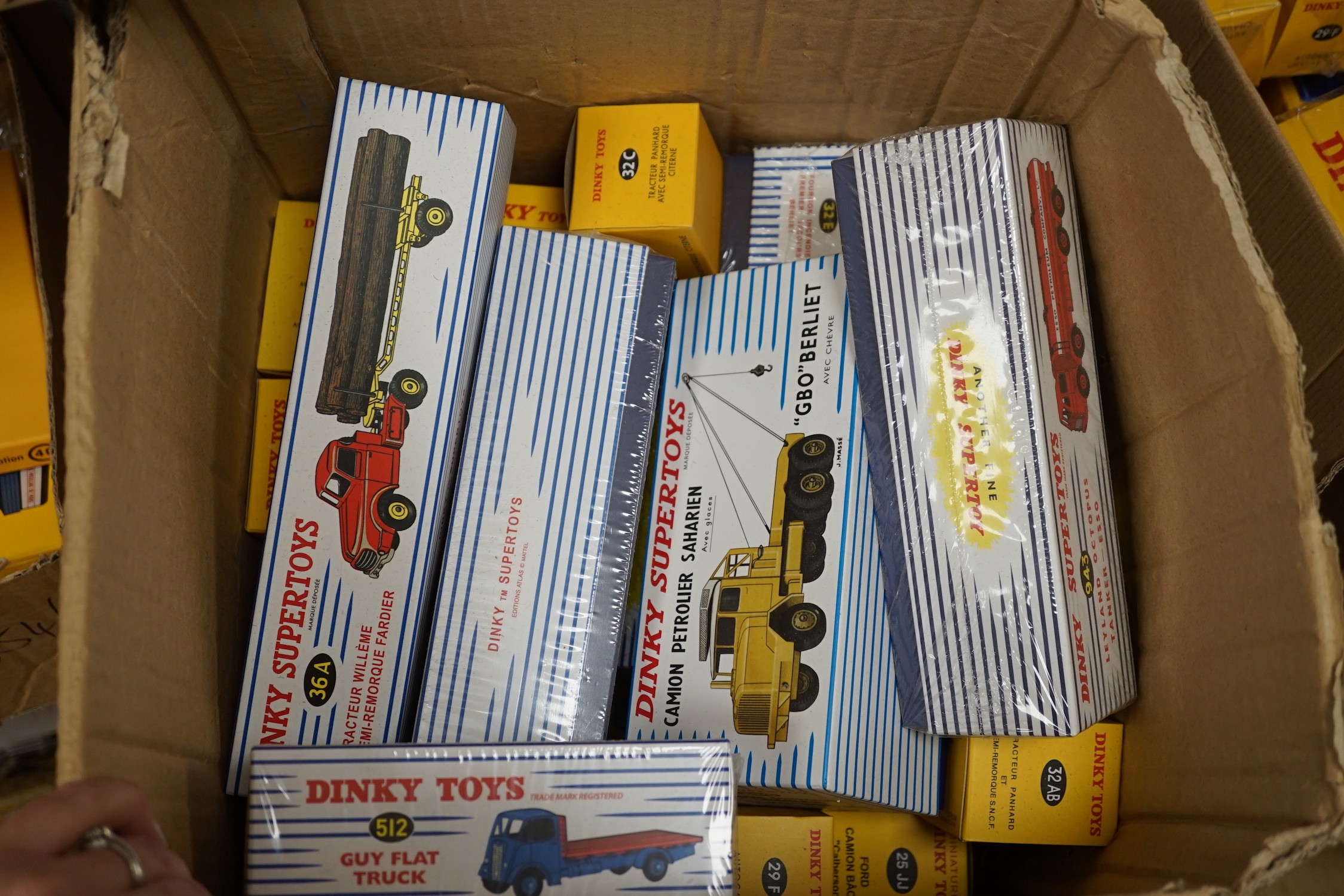 A large quantity of Norev (reproduction) boxed dinky lorries, vans, road sins, petrol pump, etc